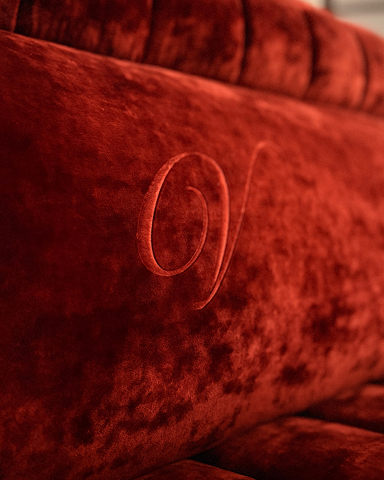 Red velvet banquette seating at Vito's